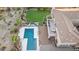 Aerial view of backyard showcasing a pool, patio, putting green and lounge area, perfect for relaxation and recreation at 9753 E Suncrest Rd, Scottsdale, AZ 85262