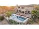 Backyard oasis featuring a sparkling pool, covered patio, and basketball court, ideal for relaxing and entertaining at 9753 E Suncrest Rd, Scottsdale, AZ 85262