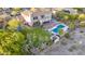 Expansive backyard featuring a pool, lush landscaping, and a basketball court, ideal for outdoor entertainment and recreation at 9753 E Suncrest Rd, Scottsdale, AZ 85262