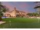A large backyard features a putting green, basketball court, patio and desert landscaping offering a recreational oasis at 9753 E Suncrest Rd, Scottsdale, AZ 85262