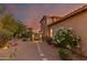 Beautiful property featuring mature landscaping, a side courtyard, and privacy gates at 9753 E Suncrest Rd, Scottsdale, AZ 85262
