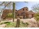 Inviting home with desert landscaping, a private courtyard, and exterior stone accents at 9753 E Suncrest Rd, Scottsdale, AZ 85262