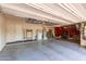 Organized garage space with ample storage solutions and a separate work area for various projects at 9753 E Suncrest Rd, Scottsdale, AZ 85262