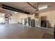 Spacious garage with a variety of storage solutions and equipment, providing ample room for organization at 9753 E Suncrest Rd, Scottsdale, AZ 85262