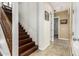 Hallway with staircase and neutral tones, providing access to various rooms and levels of the home at 9753 E Suncrest Rd, Scottsdale, AZ 85262