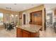 Well-appointed kitchen features a breakfast nook and a large center island with granite countertops at 9753 E Suncrest Rd, Scottsdale, AZ 85262