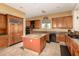 Spacious kitchen with granite countertops, stainless steel appliances, and center island for food prep at 9753 E Suncrest Rd, Scottsdale, AZ 85262