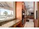 Gourmet kitchen featuring granite countertops and stainless steel appliances with great backyard views at 9753 E Suncrest Rd, Scottsdale, AZ 85262