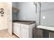 Well-organized laundry room featuring ample storage, countertops, and a convenient hanging rack at 9753 E Suncrest Rd, Scottsdale, AZ 85262