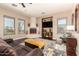 Comfortable living room featuring a fireplace, mounted TV, and plenty of seating for gatherings at 9753 E Suncrest Rd, Scottsdale, AZ 85262