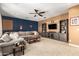 Open-concept living area with entertainment center and plush furniture, perfect for relaxing and entertaining at 9753 E Suncrest Rd, Scottsdale, AZ 85262
