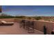 Inviting patio area with comfortable lounge seating, perfect for relaxing and enjoying the natural desert scenery at 9753 E Suncrest Rd, Scottsdale, AZ 85262