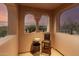 Covered patio with archways featuring outdoor seating, offering a serene spot to enjoy the view at 9753 E Suncrest Rd, Scottsdale, AZ 85262