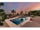 Stunning backyard pool with desert landscaping, creating a tranquil oasis for relaxation and recreation at 9753 E Suncrest Rd, Scottsdale, AZ 85262