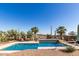 The pool has a baja shelf and great landscaping, with desert views from the comfortable seating area at 9753 E Suncrest Rd, Scottsdale, AZ 85262