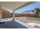 Low maintenance backyard with gravel, artificial turf, and a covered patio at 1031 W Longhorn Dr, Chandler, AZ 85286