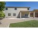 Back exterior view of home featuring covered patio and low-maintenance landscape at 1031 W Longhorn Dr, Chandler, AZ 85286