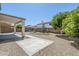 Spacious backyard featuring gravel, artificial turf and covered patio at 1031 W Longhorn Dr, Chandler, AZ 85286