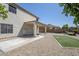 Exterior view of the home showcasing the backyard, covered patio, and low-maintenance landscape at 1031 W Longhorn Dr, Chandler, AZ 85286