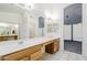 Spacious bathroom with dual sinks, ample counter space, and a walk-in closet, perfect for organization at 1031 W Longhorn Dr, Chandler, AZ 85286