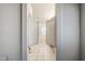 Bathroom entry with swinging doors leading to a bathtub and single window at 1031 W Longhorn Dr, Chandler, AZ 85286