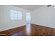 Bedroom with hardwood floors and bright natural light from a window at 1031 W Longhorn Dr, Chandler, AZ 85286