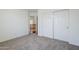 View of bedroom with double closets and a peek at the second floor landing at 1031 W Longhorn Dr, Chandler, AZ 85286