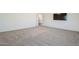 Spacious carpeted bedroom with an entrance and a mounted television at 1031 W Longhorn Dr, Chandler, AZ 85286