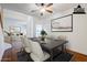 Elegant dining room with seating for six, accented by a modern ceiling fan and decorative artwork at 1031 W Longhorn Dr, Chandler, AZ 85286