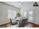 Cozy dining area boasts a marble table, seating for four, and access to a patio with double doors at 1031 W Longhorn Dr, Chandler, AZ 85286