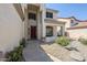 Welcoming front entrance with covered porch and path lined with flowering plants at 1031 W Longhorn Dr, Chandler, AZ 85286