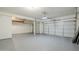 Spacious three-car garage with ample room for vehicles and storage at 1031 W Longhorn Dr, Chandler, AZ 85286