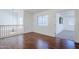 Second-floor hall with hardwood floors and decorative railing at 1031 W Longhorn Dr, Chandler, AZ 85286