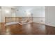 Hallway with wood floors and wooden railing looking over the stairs at 1031 W Longhorn Dr, Chandler, AZ 85286