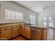The kitchen offers stainless appliances, lots of counter space, a sink, and backyard views at 1031 W Longhorn Dr, Chandler, AZ 85286