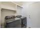 Well-equipped laundry room featuring modern appliances and ample storage space at 1031 W Longhorn Dr, Chandler, AZ 85286