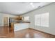 Open floor plan with archways and wood floors leads to the kitchen at 1031 W Longhorn Dr, Chandler, AZ 85286