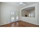 The living room has wood floors, a ceiling fan, and a pass-through to another room at 1031 W Longhorn Dr, Chandler, AZ 85286