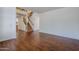 Open-concept living area with hardwood floors, staircase, and abundant natural light at 1031 W Longhorn Dr, Chandler, AZ 85286