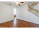 Open living room featuring hardwood floors, natural light, and a staircase leading to the upper level at 1031 W Longhorn Dr, Chandler, AZ 85286