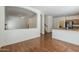 Open floor plan with archways connecting to kitchen and stairs, plus beautiful wood flooring at 1031 W Longhorn Dr, Chandler, AZ 85286