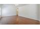 Spacious living room with hardwood floors and a ceiling fan at 1031 W Longhorn Dr, Chandler, AZ 85286