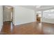 The living room features wood floors and an open layout with a view to the kitchen and entry at 1031 W Longhorn Dr, Chandler, AZ 85286