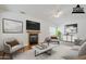 Comfortable living area featuring a fireplace, modern decor, and hardwood flooring at 1031 W Longhorn Dr, Chandler, AZ 85286