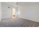 Large main bedroom with neutral carpet, vaulted ceiling, and ensuite bathroom entry at 1031 W Longhorn Dr, Chandler, AZ 85286