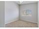 Neutral bedroom with carpet and a large window providing natural light at 10334 E Diamond Ave, Mesa, AZ 85208
