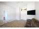 Bedroom with carpet, a ceiling fan, and a large picture window at 10334 E Diamond Ave, Mesa, AZ 85208