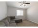 Bedroom showcasing comfortable seating, carpet, and window with natural light at 10334 E Diamond Ave, Mesa, AZ 85208