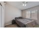 Bedroom featuring a double bed, ceiling fan and built-in wardrobe at 10334 E Diamond Ave, Mesa, AZ 85208