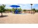Community playground with fun features including swings, slides, and picnic tables at 10334 E Diamond Ave, Mesa, AZ 85208